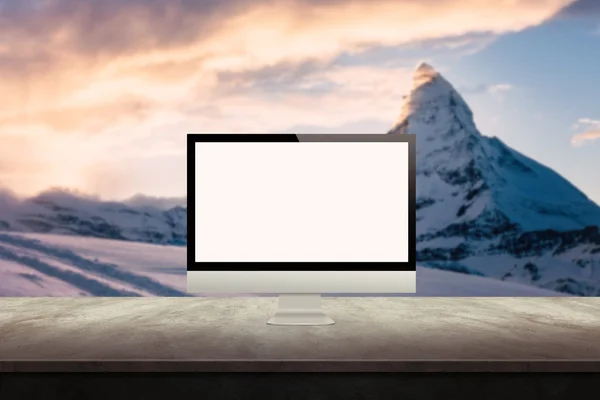 computer display on desk with mountain in the background mock up presentation