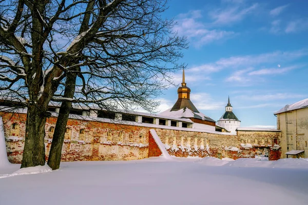 View of the inner wall of the Kirillo-Belozersky Monastery and the preserved fragment of the Granovitoya Tower on a frosty winter evening, Kirillov, Vologda region, Russia