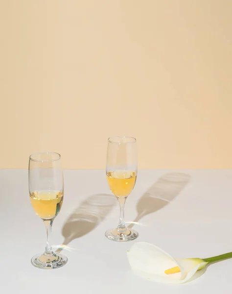 Pair Wine Glasses White Calla Lily Flower Champagne Colored Background Stock Picture