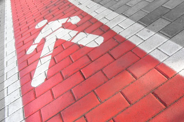 Perspektivní zobrazení pro chodce červený pruh podél chodníku — Stock fotografie