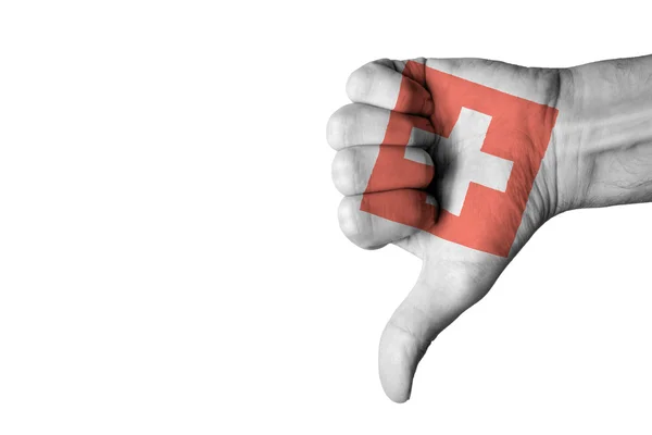 Bandiera svizzera sul pollice umano maschio verso il basso mano — Foto Stock