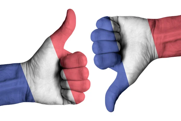 Nederländerna flagga på mänskliga manliga tummen upp och ner händerna — Stockfoto