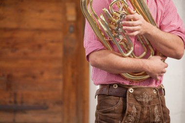 Musician in typical costume during an autumn local celebration in Val Isarco ( South Tirol ) clipart