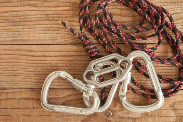 Mountain gear for climbing on wooden background — Stock Photo, Image