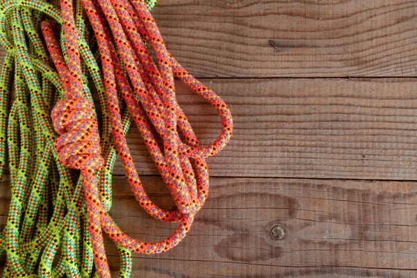 Mountain rope on wooden background — Stock Photo, Image