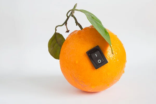 Single orange with switch in power off position on light grey ba — Stock Photo, Image