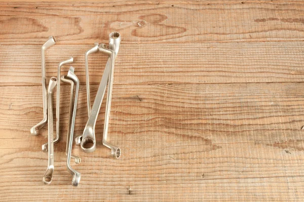 Wrenches set on wood background — Stock Photo, Image