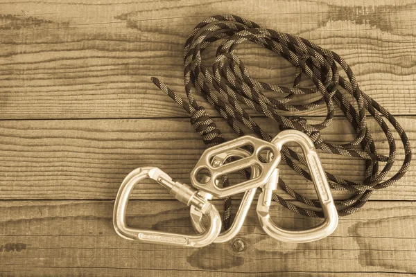 Mountain gear for climbing on wooden background — Stock Photo, Image