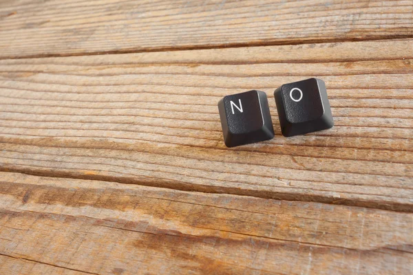 Niet schreef met toetsen op het toetsenbord op houten achtergrond — Stockfoto