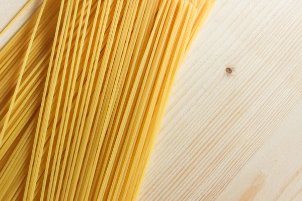 Uncooked Italian spaghetti as background — Stock Photo, Image