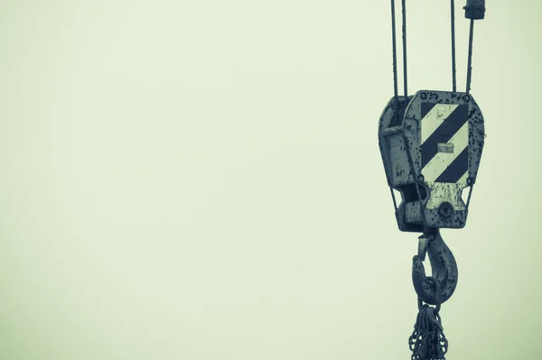 Focus on crane at work — Stock Photo, Image