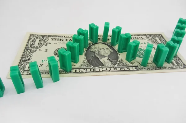 stock image Domino on one dollar bill