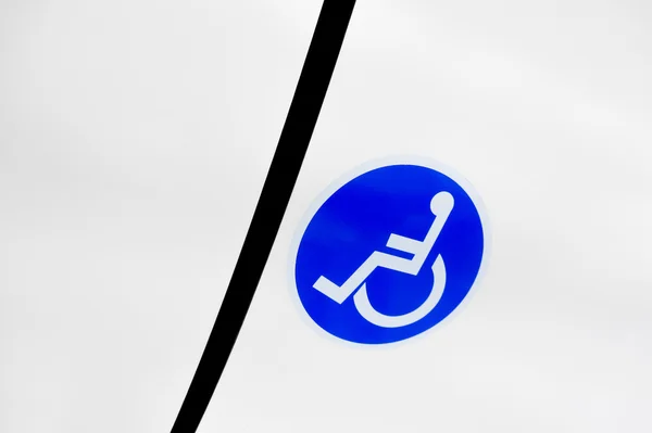 Reserved seat label on board bus for disabled people — Stock Photo, Image