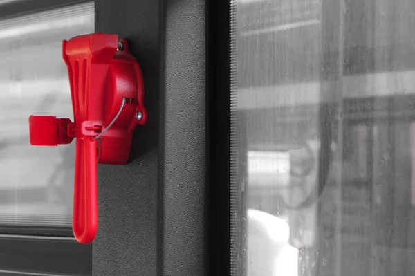 Red evacuation hammer on board public transport
