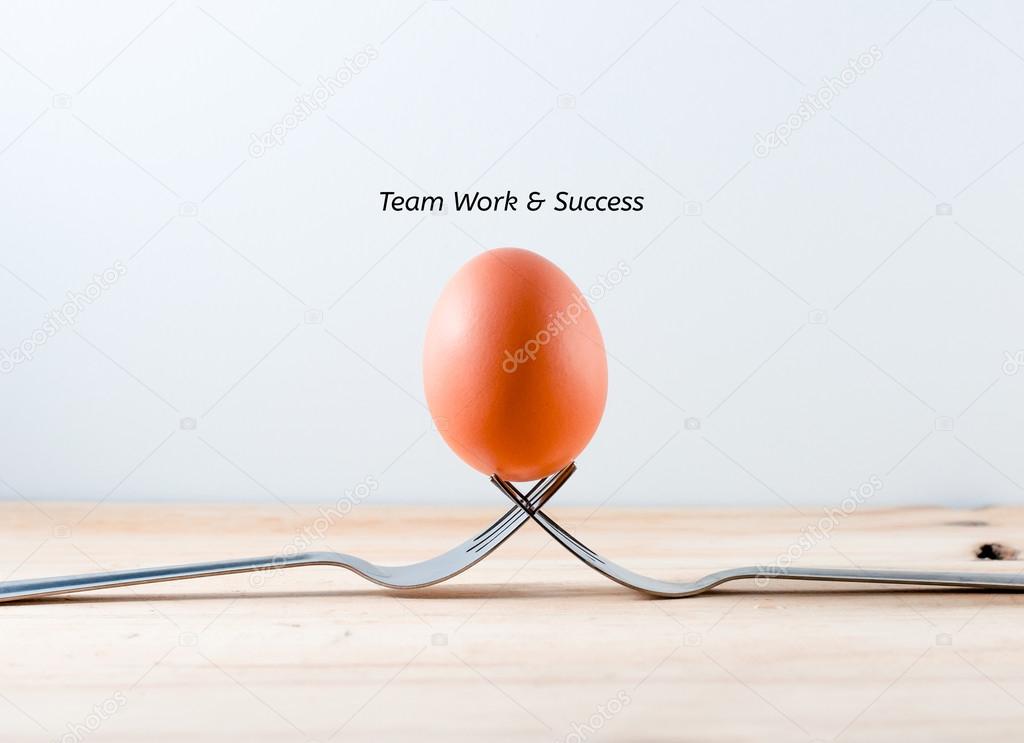 Egg on the fork with text teamwork business concept