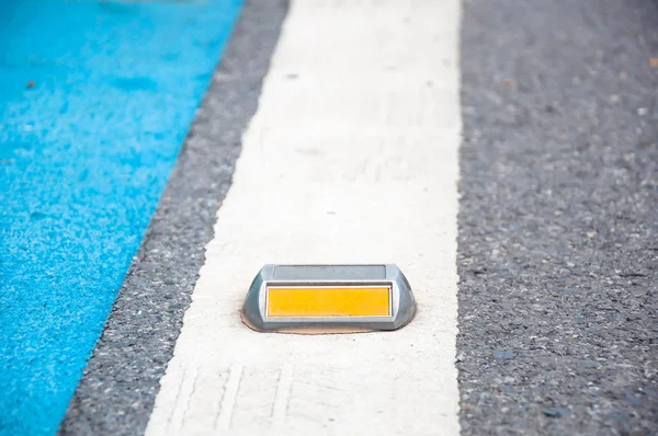 The Close up of reflector or stud on asphalt road — Stock Photo, Image