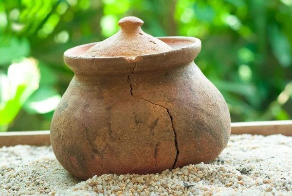 Broken Clay pots or porttery on a white sand outside kitchen roo — Stock Photo, Image