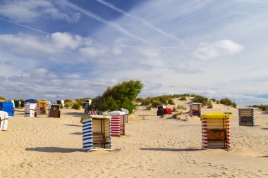 Beach chairs on the beach of Borkum island. North sea. Germany. clipart