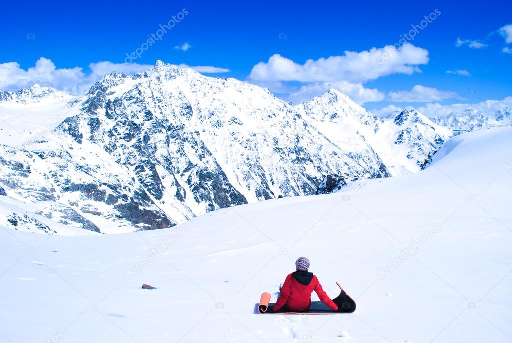 Woman in mountains, watching beautiful landscape