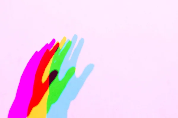 Colored hand shadows in the light spectrum with the the addition — Stock Photo, Image