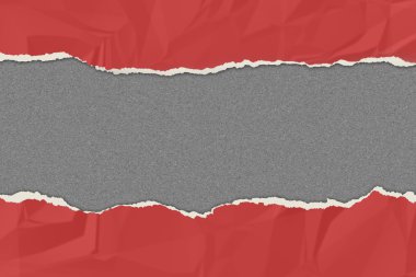 Kırmızı kağıt gri tahtada sökük.