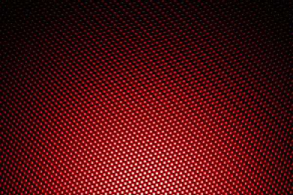 Reflektor na pozadí červené uhlíkové vlákno. — Stock fotografie