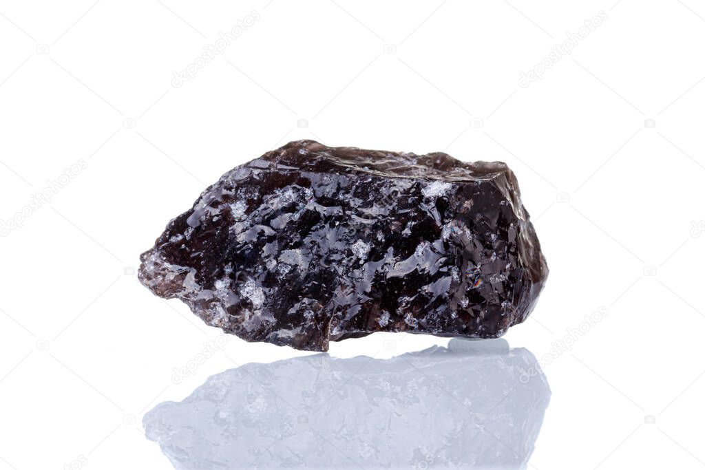 macro mineral stone Obsidian on a white background close-up