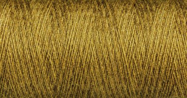 Sarı iplik dokuması yenilikçi tekstil tasarımları için idealdir. Dokuma katmanları kumaş bileşimlerine yeni bir boyut ekler..