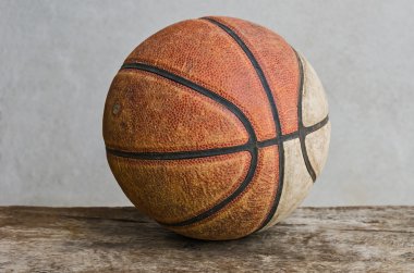 Old basketball on table clipart