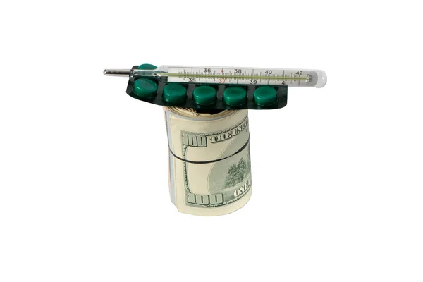 Money tied with an elastic band. pills and a thermometer lie on dollar bills. — Stock Photo, Image