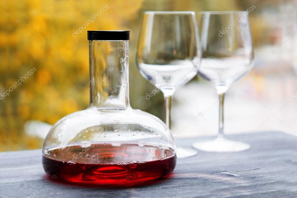 wine decanter and empty glasses 