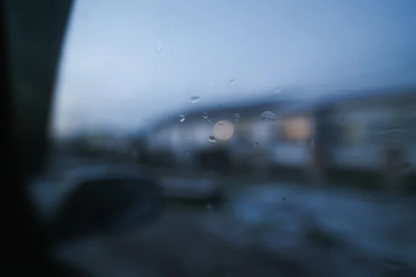 Raindrops on windshield of moving car — Stock Photo, Image