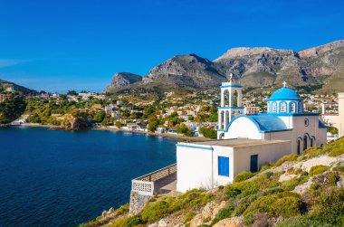 White church with azure blue dome Island, Greece clipart