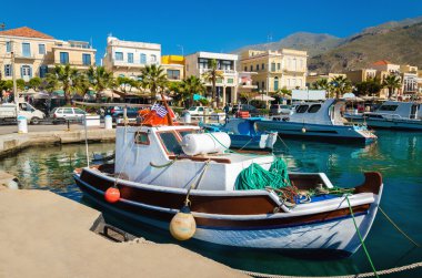 Colorful wooden boats in cosy Greek port clipart