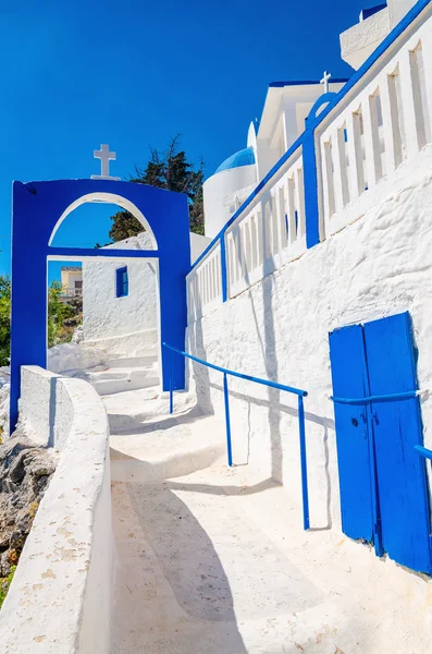 Greek church with iconic blue and white stairs — Stock Photo, Image
