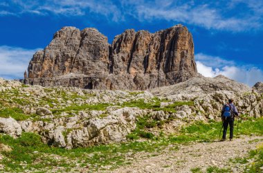 tourist with a backpack trekking  at mountains