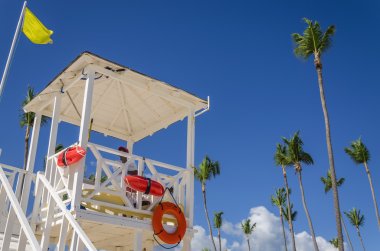 Lifeguard tower on sandy Caribbean beach clipart