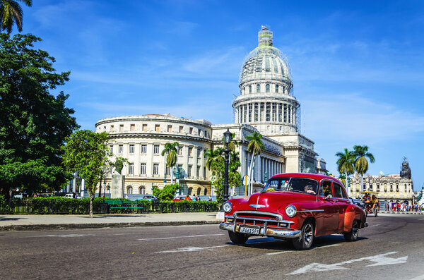car rides in front of the Capitol