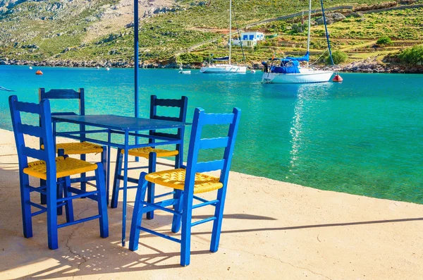 Wooden blue chairs in Greek restaurant, Greece — Stock Photo, Image