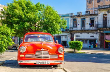 Classic American red car on street of Havana Cuba  clipart