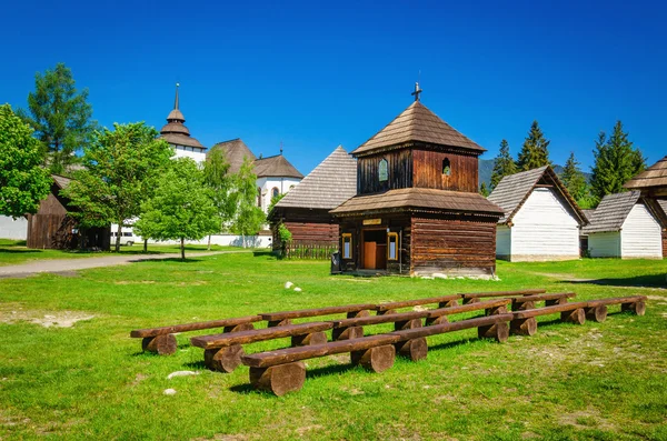 Rare wooden bell tower with folk houses Slovakia — Stock Photo, Image