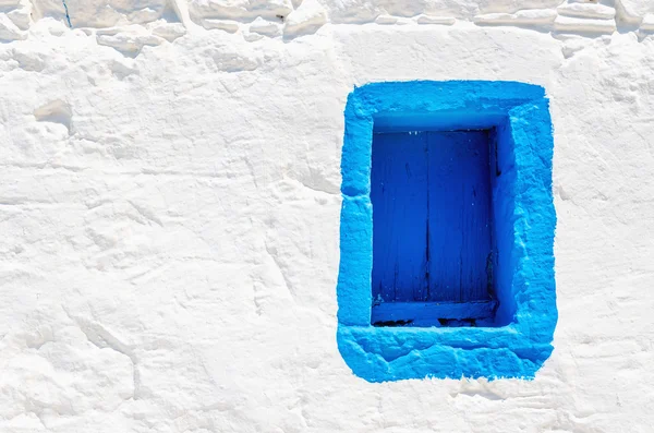 Blue wooden window on white stone wall, Greece — Stock Photo, Image