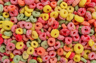 Detail of cereal fruit rings filling the frame. Capture top view.