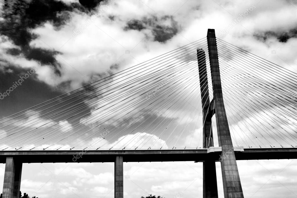Vasco Da Gama bridge perspectives under cloudy sky in Lisbon. Drama.