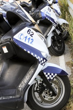 Elche, Alicante, Spain- April 6, 2021: Police motorcycles parked on the street in Elche, Spain clipart