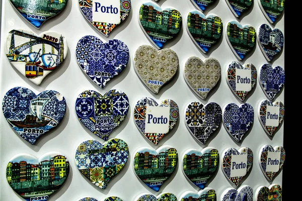 Fridge souvenir magnets imitating portuguese tiles with the word Porto writen on them for sale in Porto