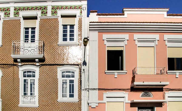 Beautiful and old colorful typical facades next to the water canal in Aveiro village in January