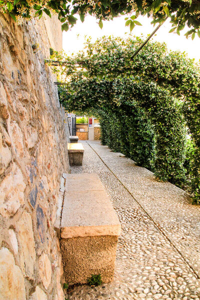 Narrow streets and beautiful gardens in Altea village, Alicante, Spain