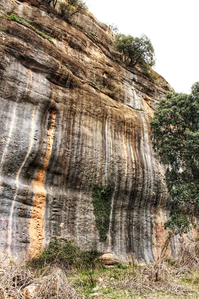 Mountain wall with colorful streaks in the Sierra of Alcaraz, Castile-la Mancha community, Spain