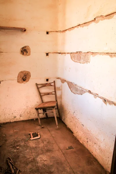 Abandoned house with broken furniture in the gold mines of Rodalquilar village in Almeria province, Spain.